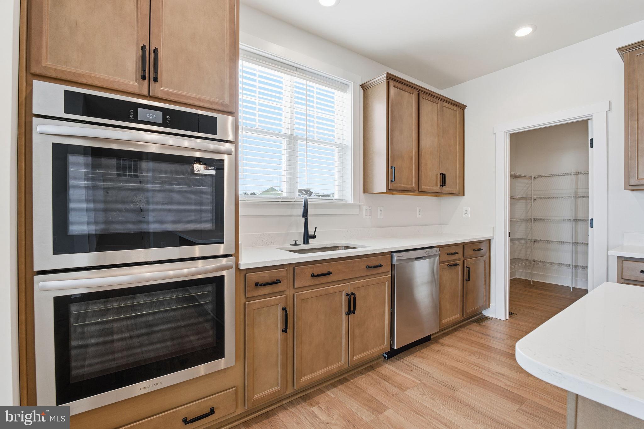 126 Bridge Valley Road Gettysburg, PA 17325 - Photo 11 of 36 a kitchen with granite countertop cabinets stainless steel appliances and wooden floor