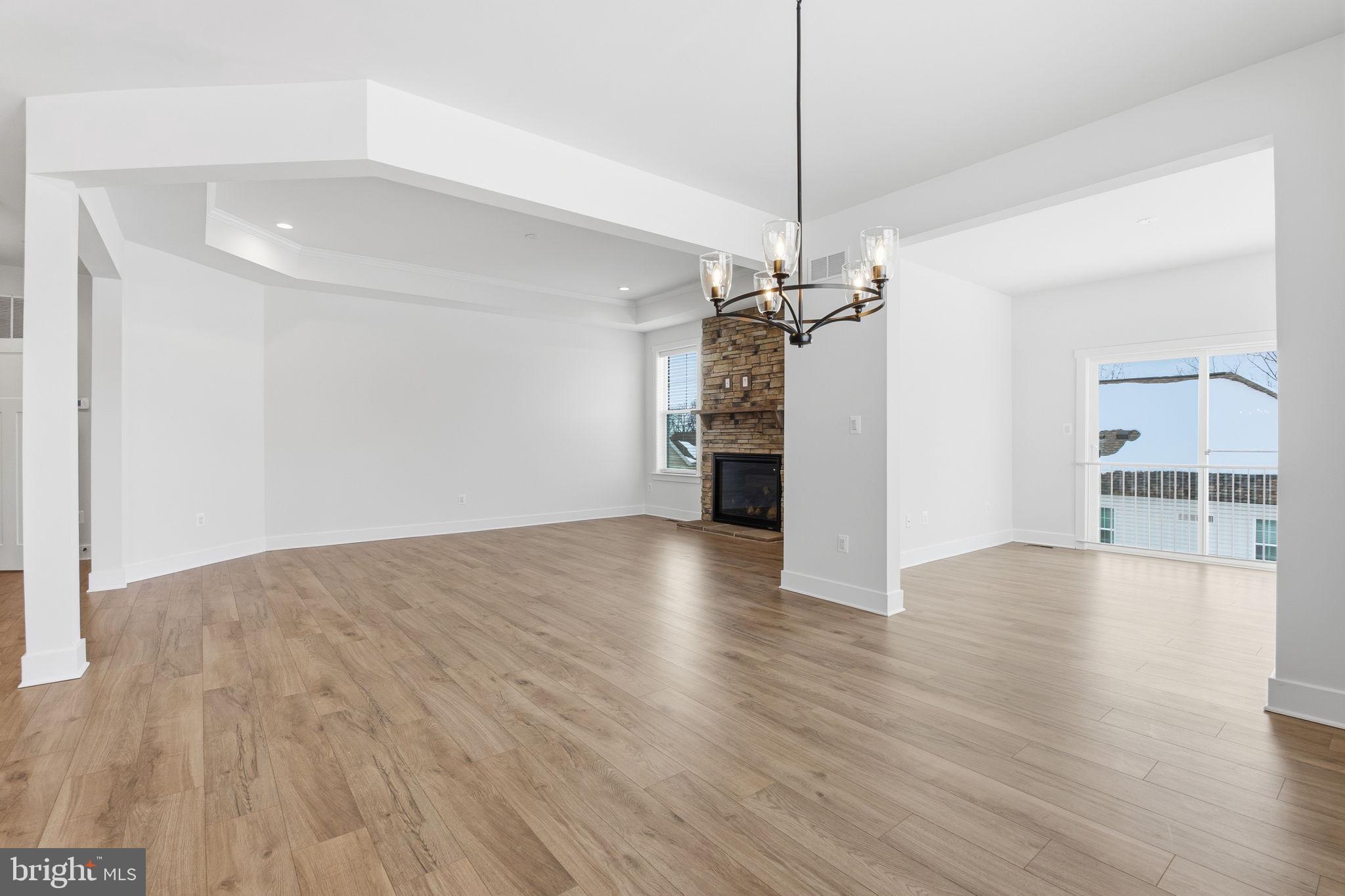 126 Bridge Valley Road Gettysburg, PA 17325 - Photo 13 of 36 a view of a livingroom with a ceiling fan wooden floor and window