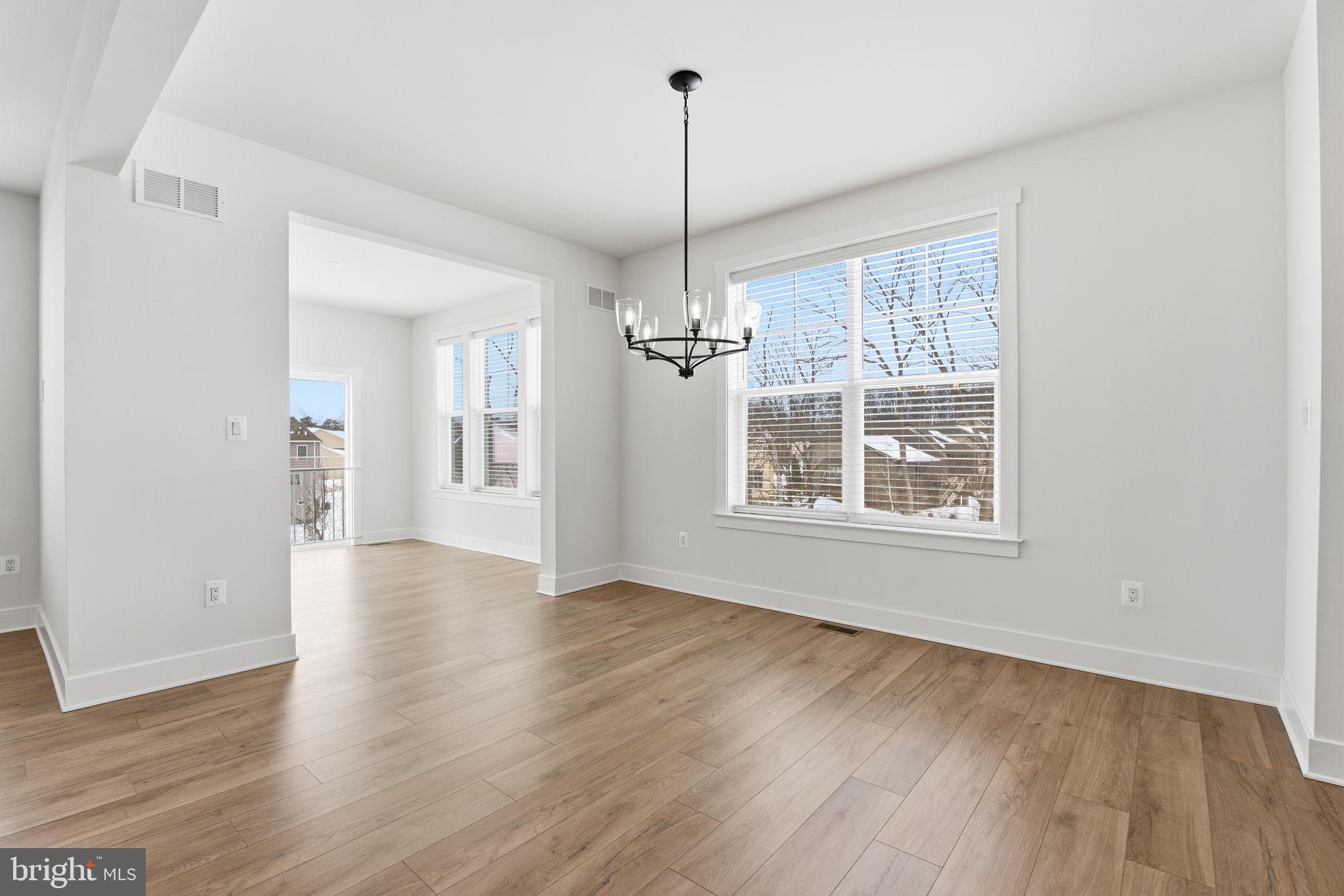 126 Bridge Valley Road Gettysburg, PA 17325 - Photo 14 of 36 a view of an empty room with a window and wooden floor