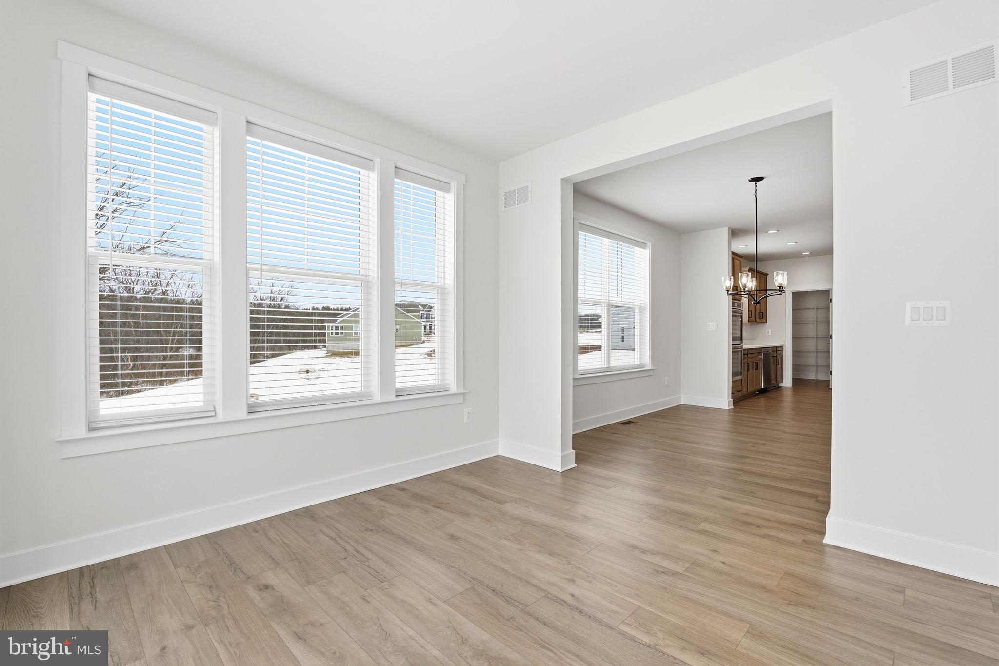 126 Bridge Valley Road Gettysburg, PA 17325 - Photo 15 of 36 a view of an empty room with a window and wooden floor