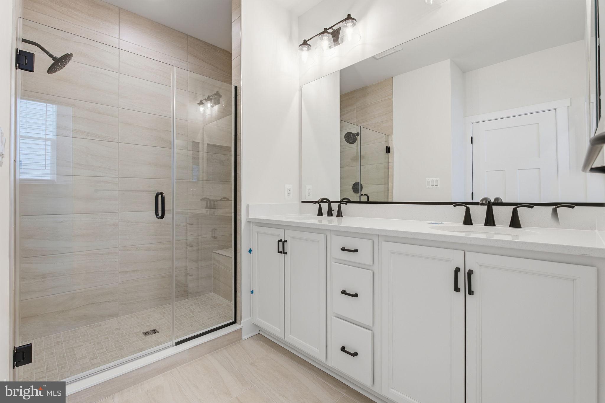 126 Bridge Valley Road Gettysburg, PA 17325 - Photo 20 of 36 a bathroom with a shower sink and mirror
