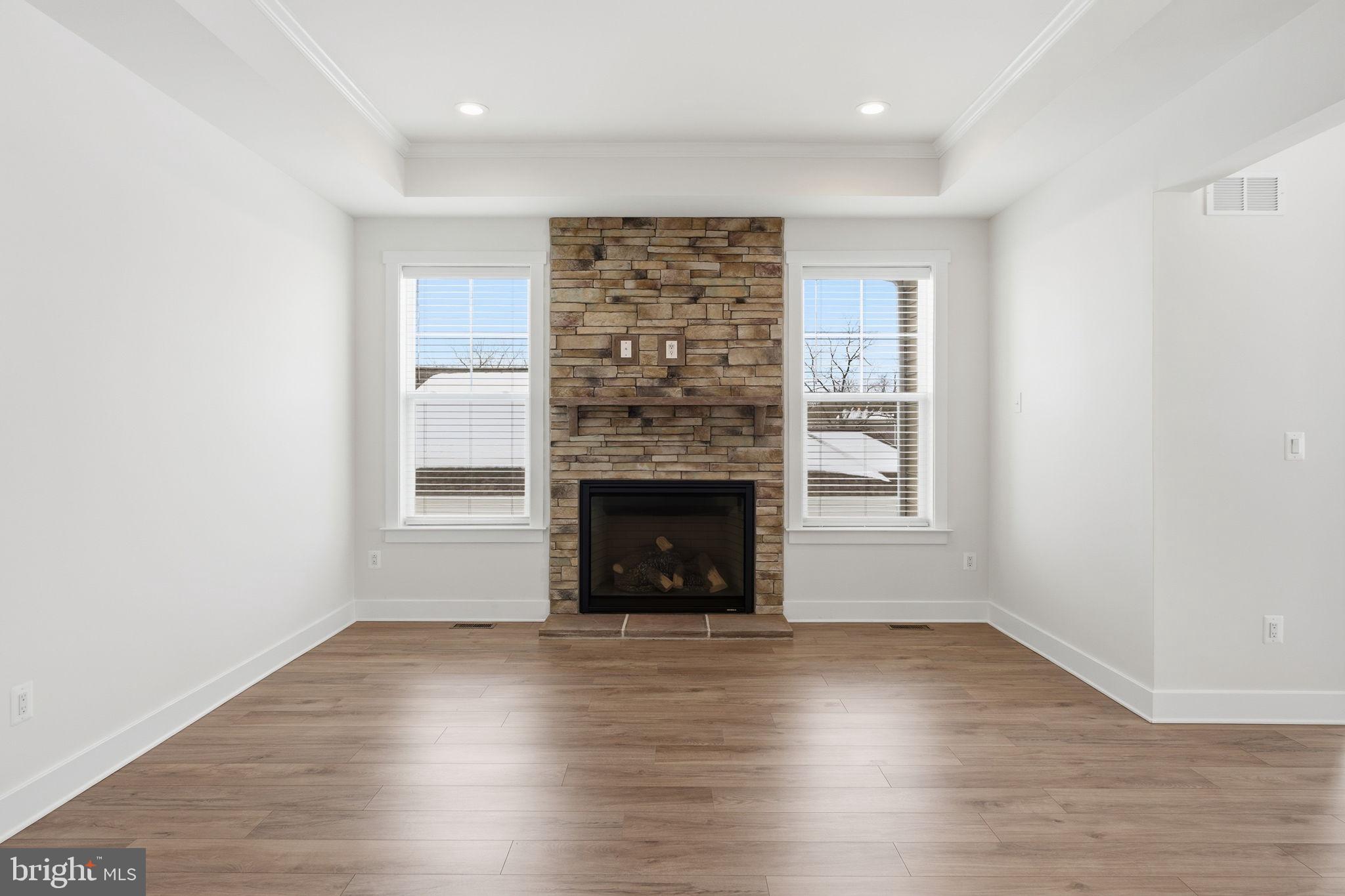 126 Bridge Valley Road Gettysburg, PA 17325 - Photo 2 of 36 a view of an empty room with wooden floor fireplace and a window