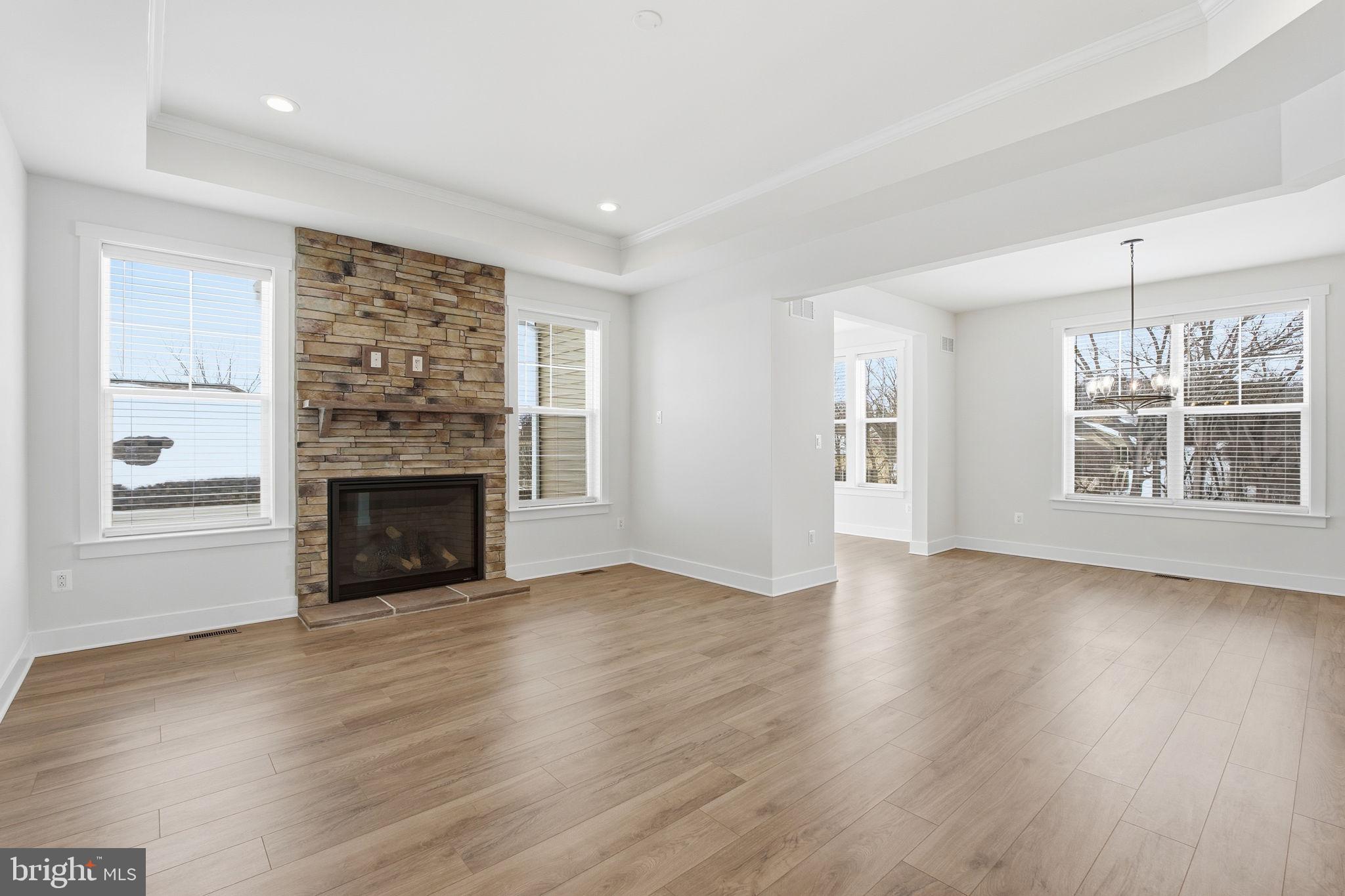 126 Bridge Valley Road Gettysburg, PA 17325 - Photo 4 of 36 wooden floor fireplace and windows in an empty room