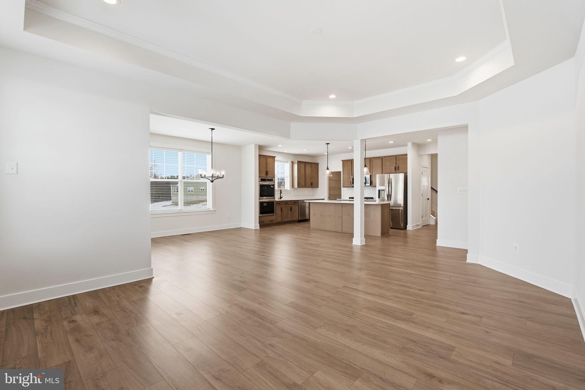 126 Bridge Valley Road Gettysburg, PA 17325 - Photo 7 of 36 a view of empty room with wooden floor and windows
