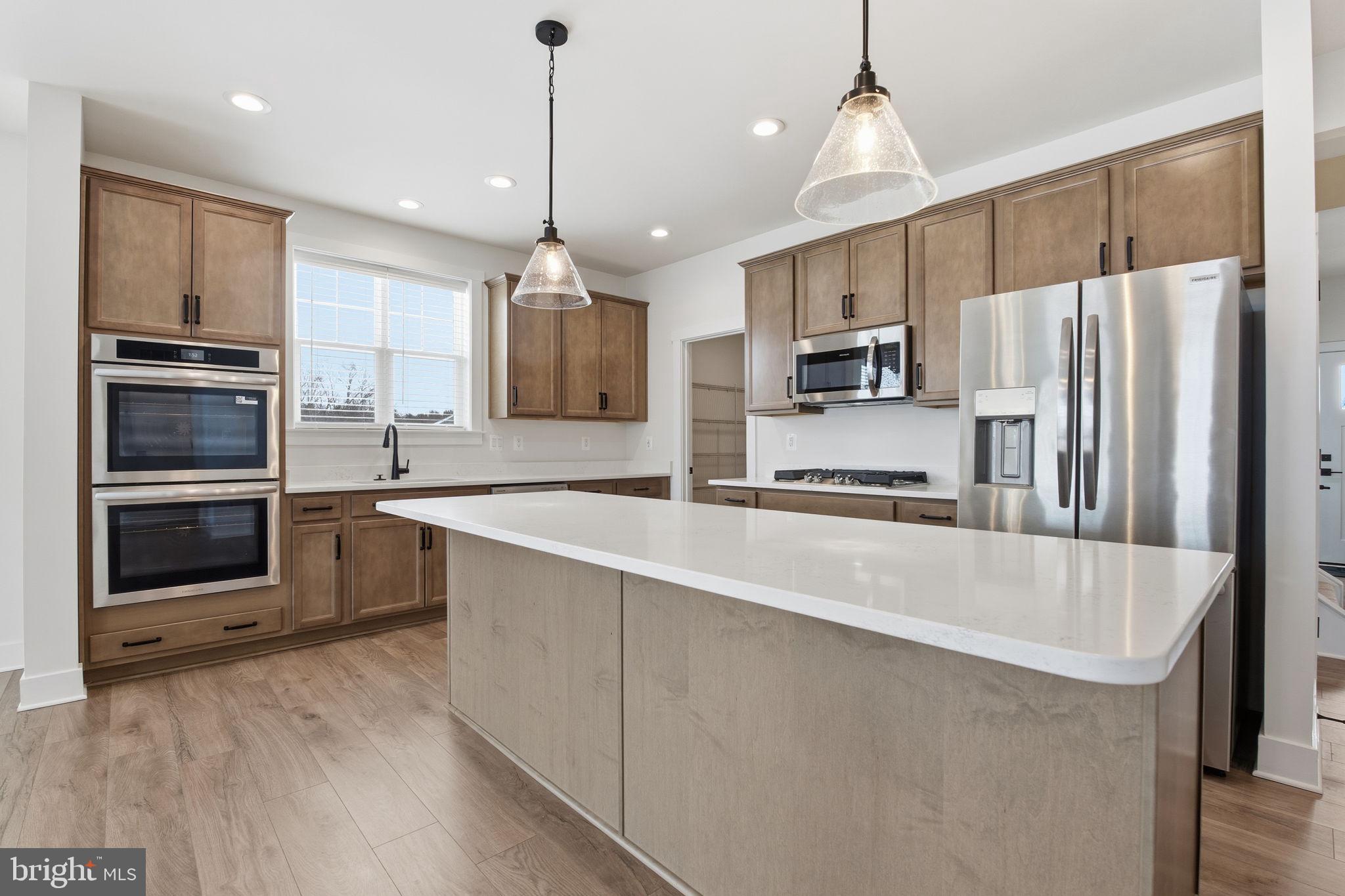 126 Bridge Valley Road Gettysburg, PA 17325 - Photo 8 of 36 a large kitchen with granite countertop a large counter top stainless steel appliances and cabinets