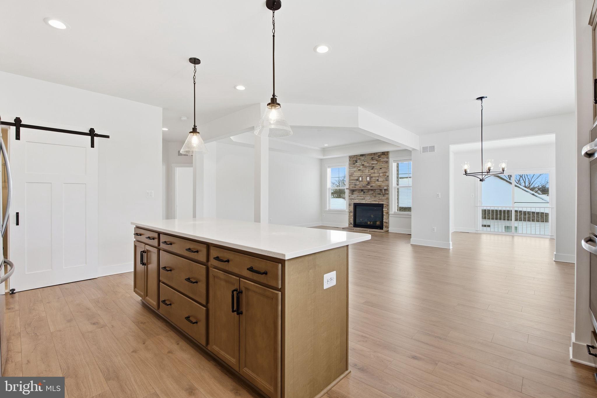 126 Bridge Valley Road Gettysburg, PA 17325 - Photo 10 of 36 a kitchen with stainless steel appliances granite countertop a stove and a wooden floor