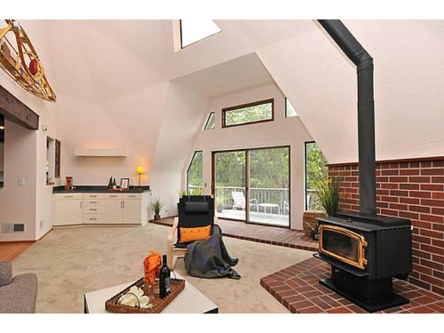3895 Page Mill Road Los Altos, CA 94022 - Photo 8 of 15 a living room with furniture a flat screen tv and a floor to ceiling window
