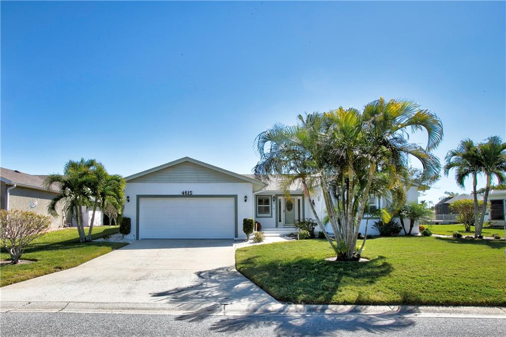 4615 Mangrove Point Road Bradenton, FL 34210 - Photo 1 of 1 a front view of a house with a garden
