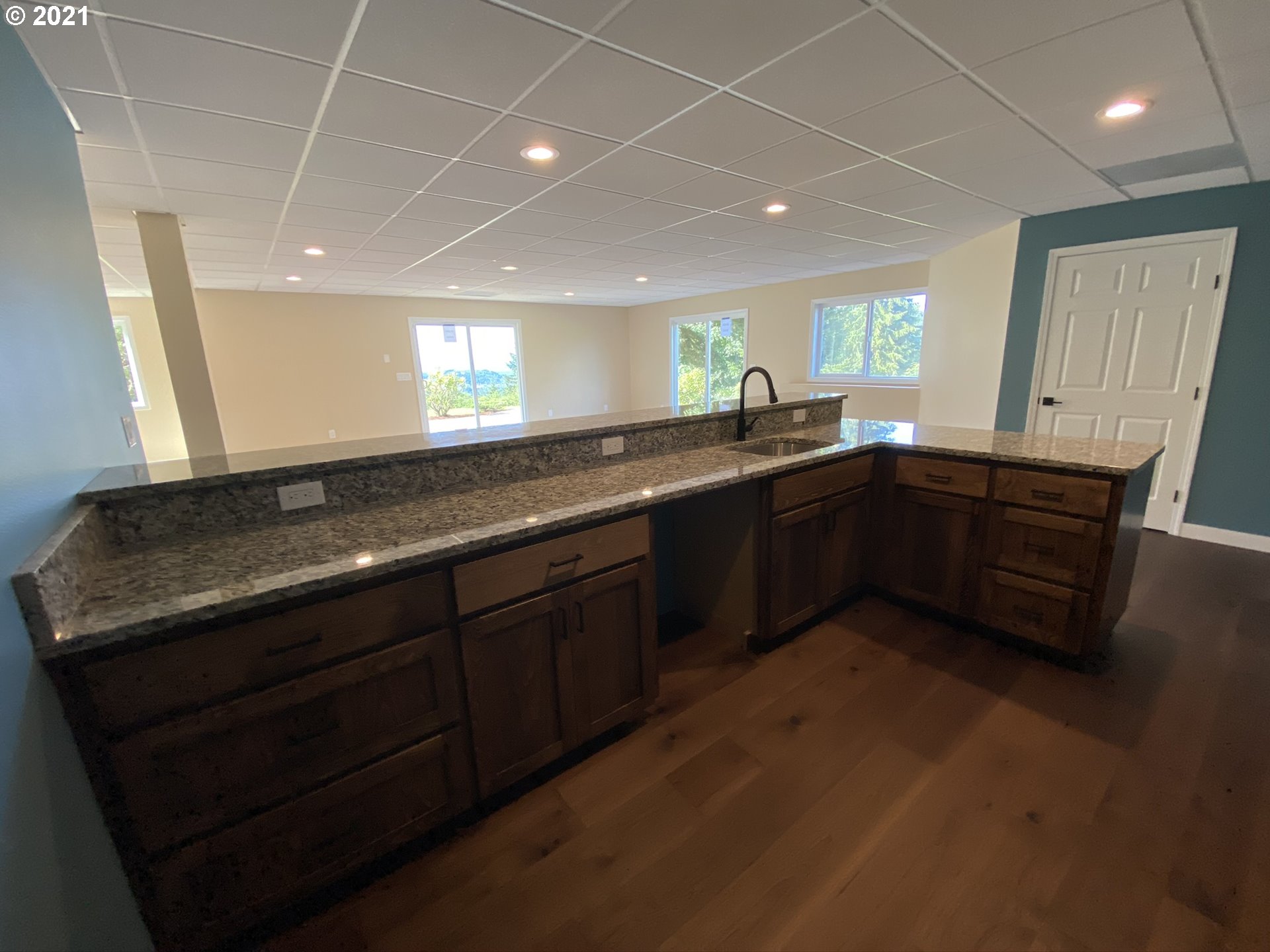 8900 Southeast Alder Ridge Road Damascus, OR 97089 - Photo 17 of 32 a large kitchen with lots of counter space and sink