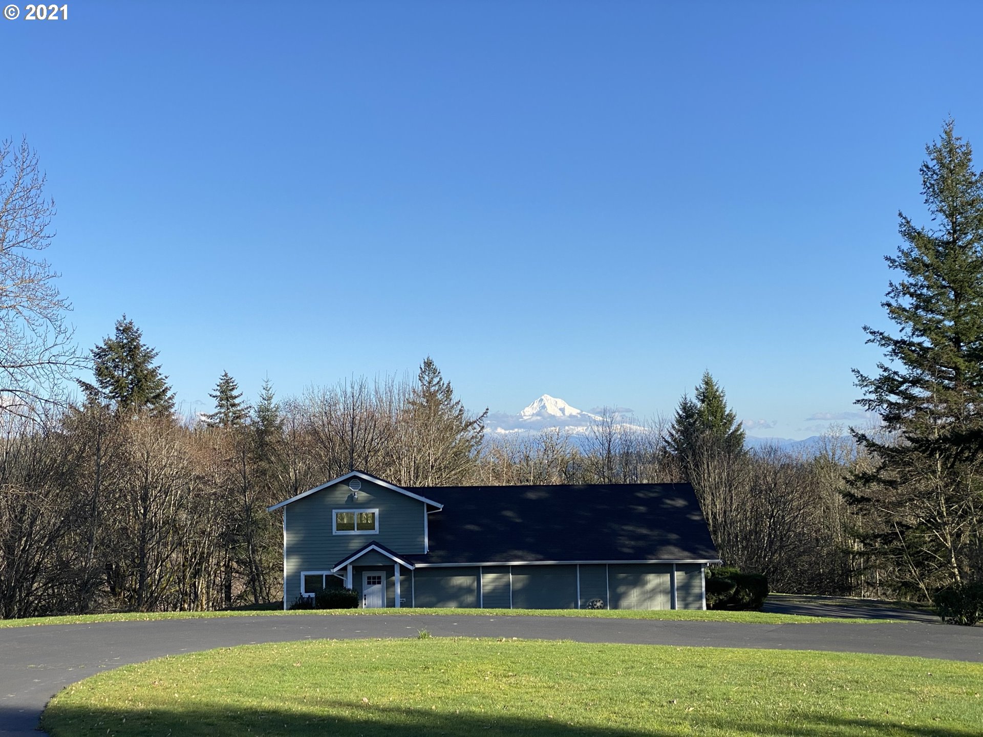 8900 Southeast Alder Ridge Road Damascus, OR 97089 - Photo 24 of 32 a view of a house with a big yard