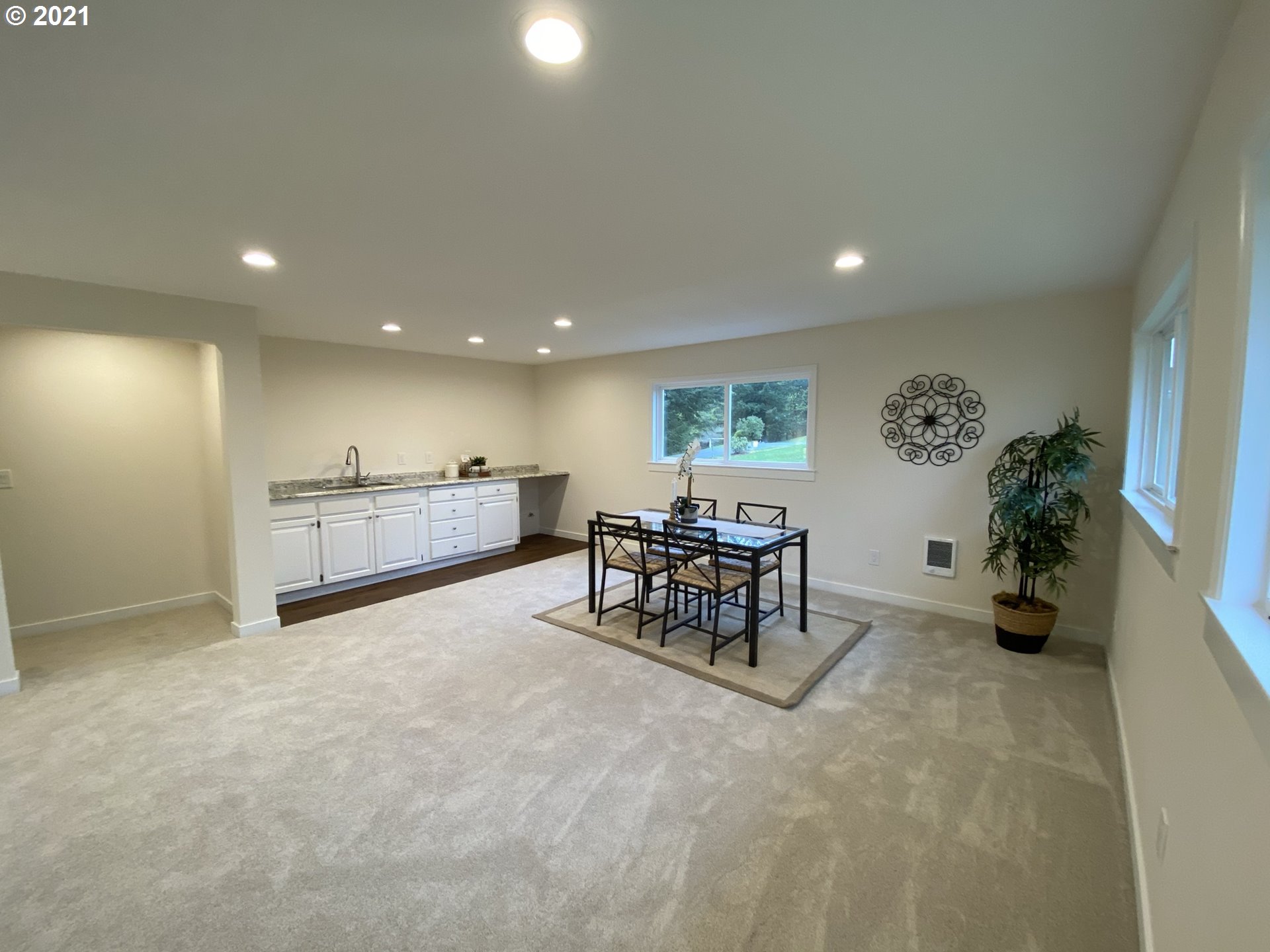 8900 Southeast Alder Ridge Road Damascus, OR 97089 - Photo 28 of 32 a view of a livingroom with furniture and a garage