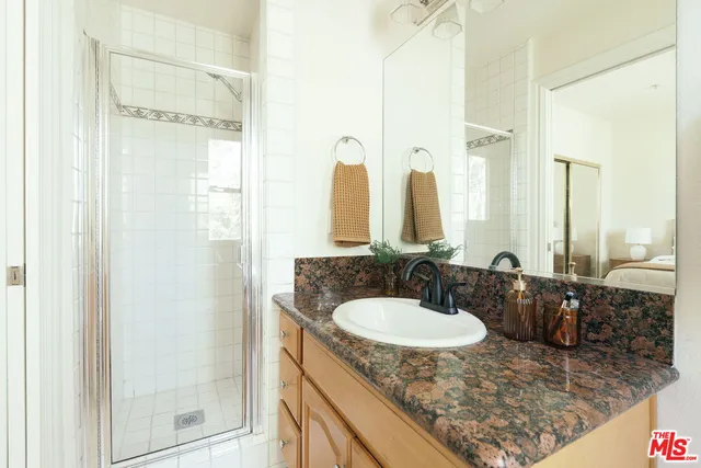 a bedroom with a bed and a walk in closet