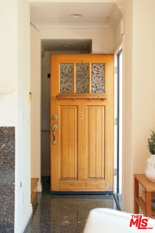 a view of front door with wooden floor