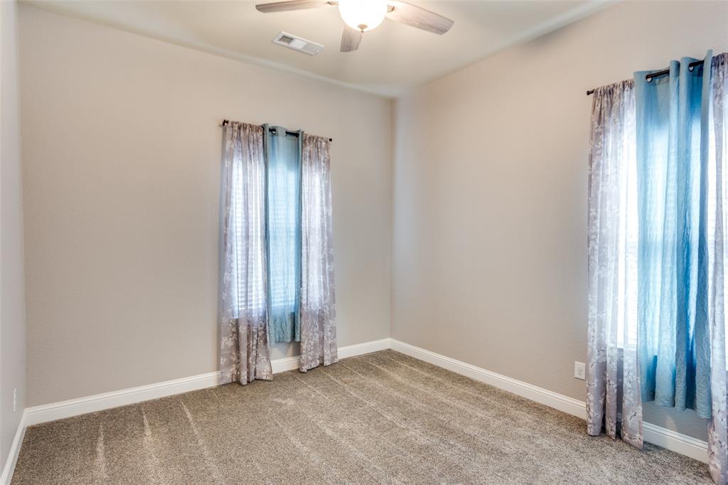 1505 5th Street Argyle, TX 76226 - Photo 20 of 25 an empty room with closet and windows