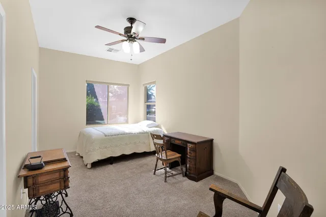 a bathroom with a sink a toilet and a large mirror