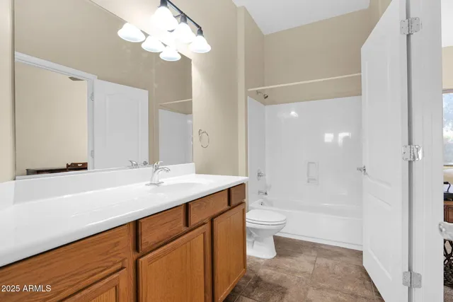 a bedroom with a bed and a table in it