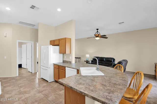 a kitchen with a table and chairs