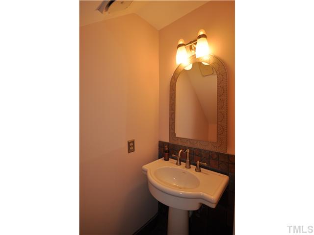 3833 Old Coach Road Raleigh, NC 27616 - Photo 11 of 24 Remodeled in 2004 with tile, pedestal sink and new light fixture.
