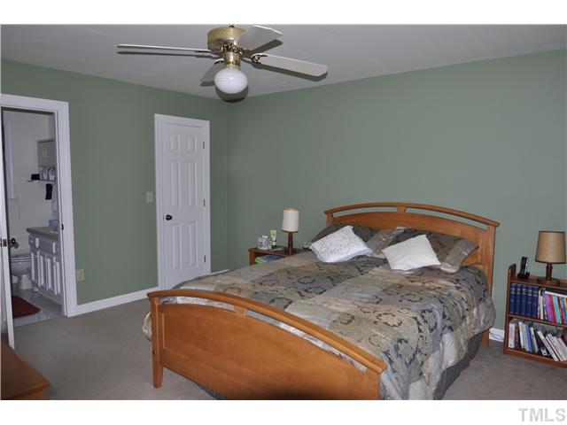 3833 Old Coach Road Raleigh, NC 27616 - Photo 12 of 24 Large walk-in closet, natural light, ceiling fan and master bath access.