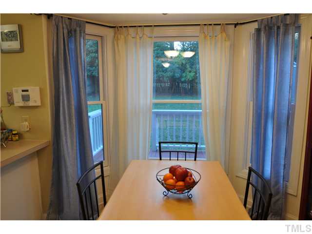 3833 Old Coach Road Raleigh, NC 27616 - Photo 2 of 24 Eat in kitchen with view of fenced in back yard through beautiful bay window rebuilt in 2007.