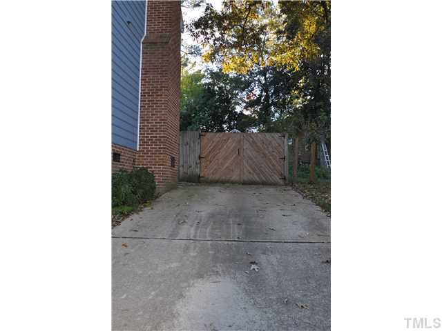 3833 Old Coach Road Raleigh, NC 27616 - Photo 22 of 24 Private parking pad behind side gate for additional parking.