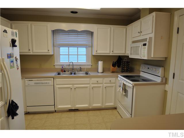 3833 Old Coach Road Raleigh, NC 27616 - Photo 3 of 24 Lots of cabinet and counter space along with breakfast bar.