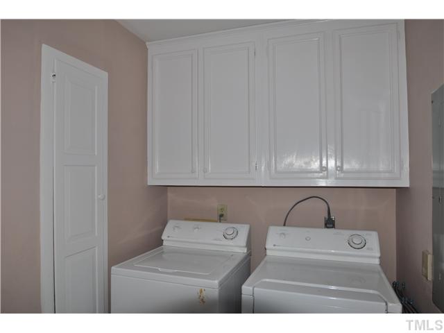 3833 Old Coach Road Raleigh, NC 27616 - Photo 9 of 24 Separate laundry room off the kitchen with lots of cabinet space. Can be used as a mud room with access to back yard and deck.