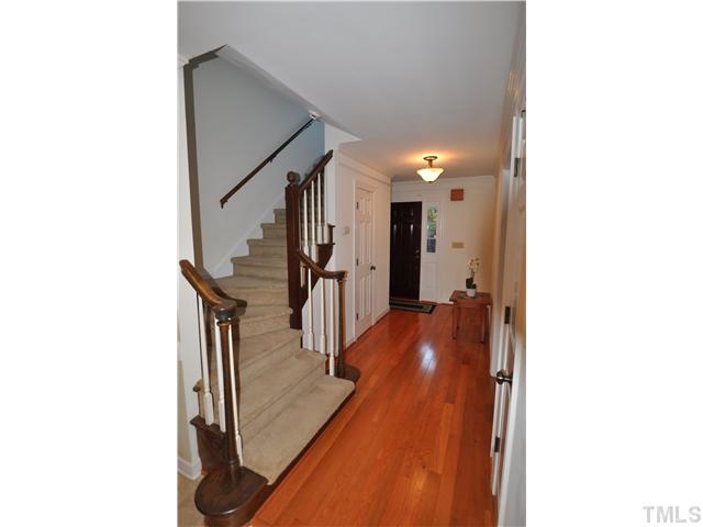 3833 Old Coach Road Raleigh, NC 27616 - Photo 10 of 24 Winding staircase to second floor off the main first floor hallway.