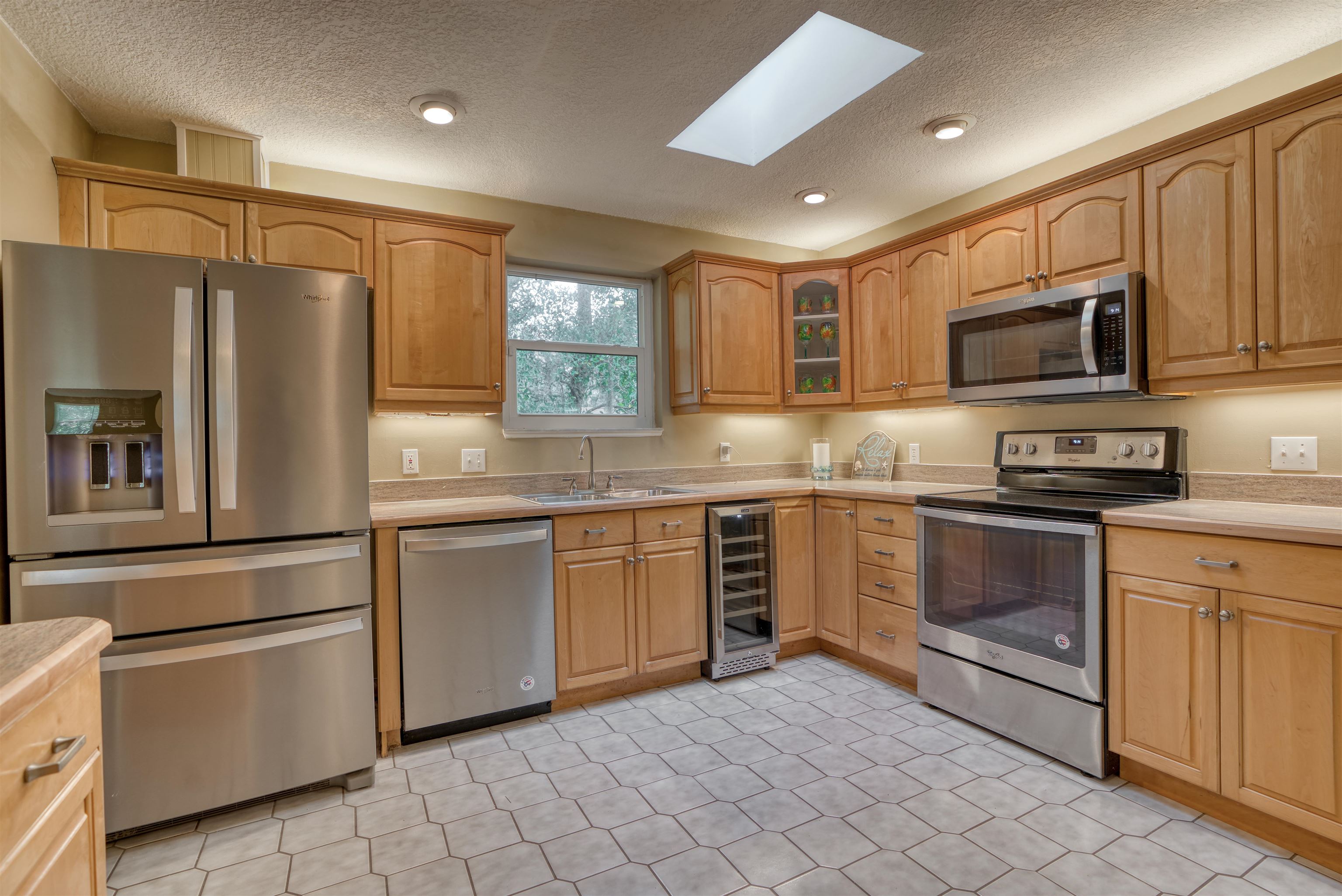 515 Gentian Road St. Augustine, FL 32086 - Photo 10 of 49 a kitchen with granite countertop a refrigerator stove top oven and sink