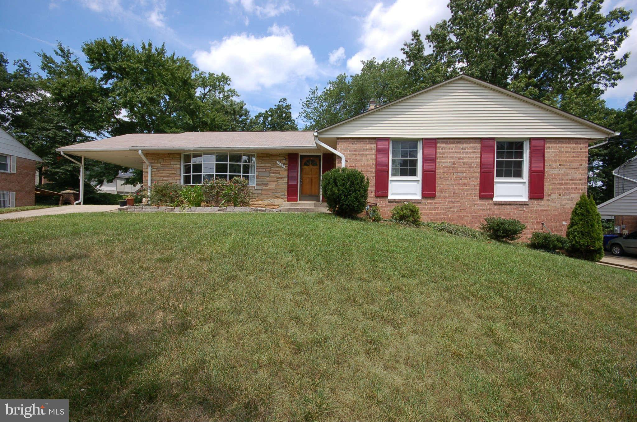 3132 Castleleigh Road Silver Spring, MD 20904 - Photo 1 of 25 a front view of a house with a garden