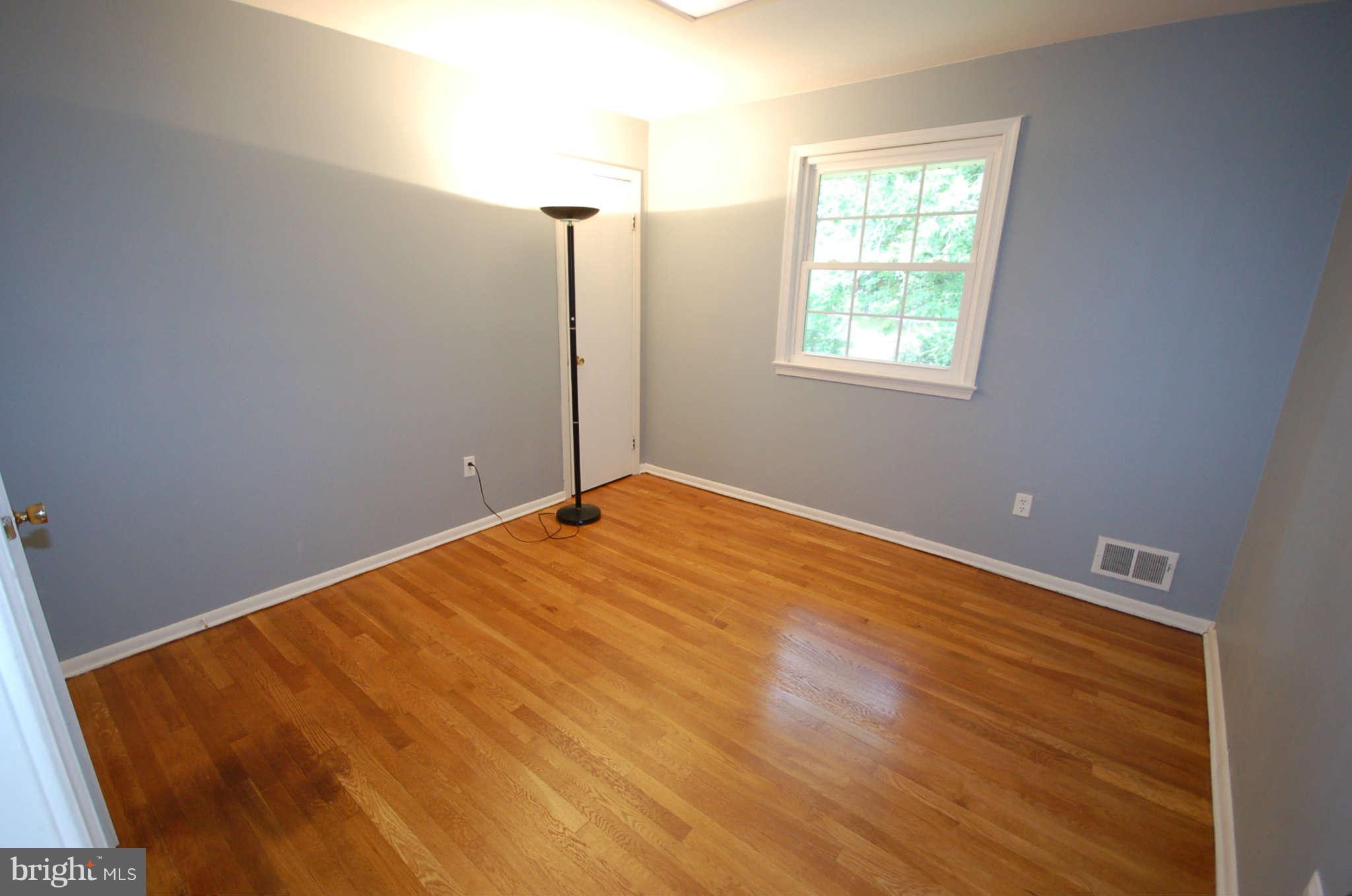 3132 Castleleigh Road Silver Spring, MD 20904 - Photo 11 of 25 a view of a room with wooden floor and window