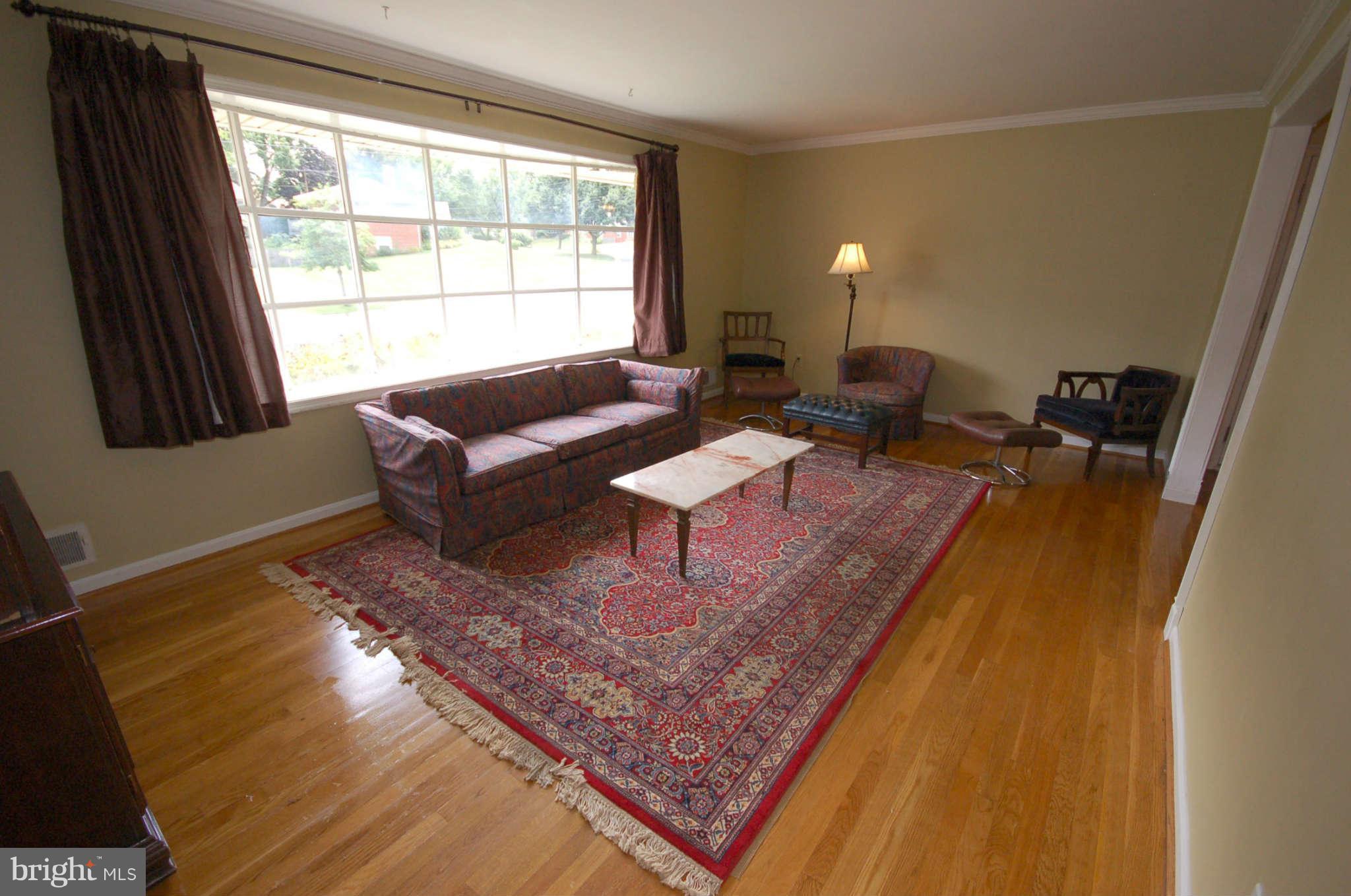 3132 Castleleigh Road Silver Spring, MD 20904 - Photo 4 of 25 a living room with furniture and a window
