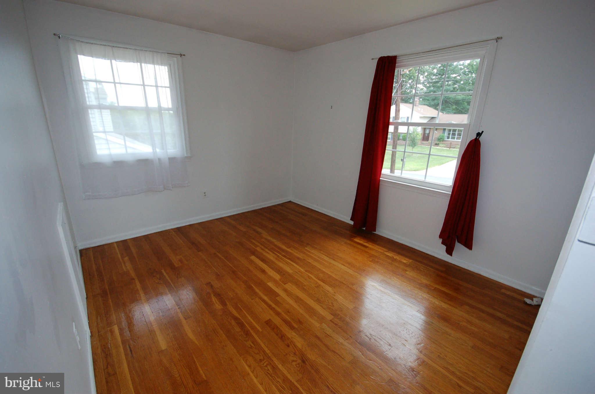 3132 Castleleigh Road Silver Spring, MD 20904 - Photo 10 of 25 a view of empty room with wooden floor and fan