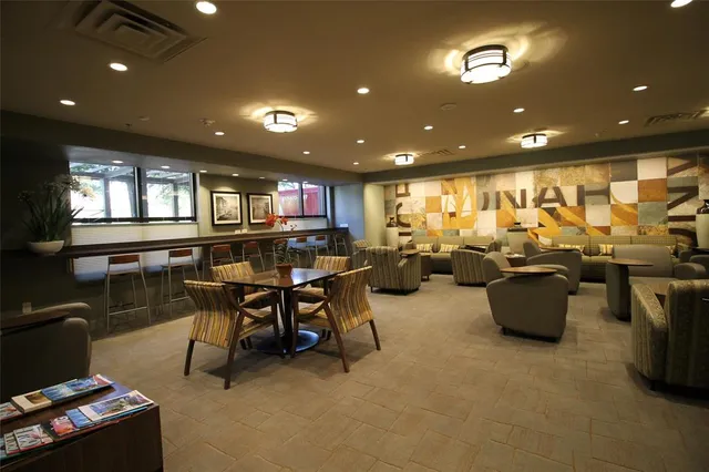 a room with gym equipment and a large window