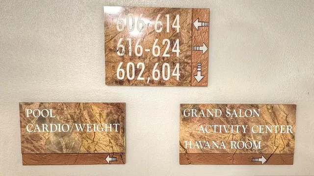 a sign on a wall next to a wall