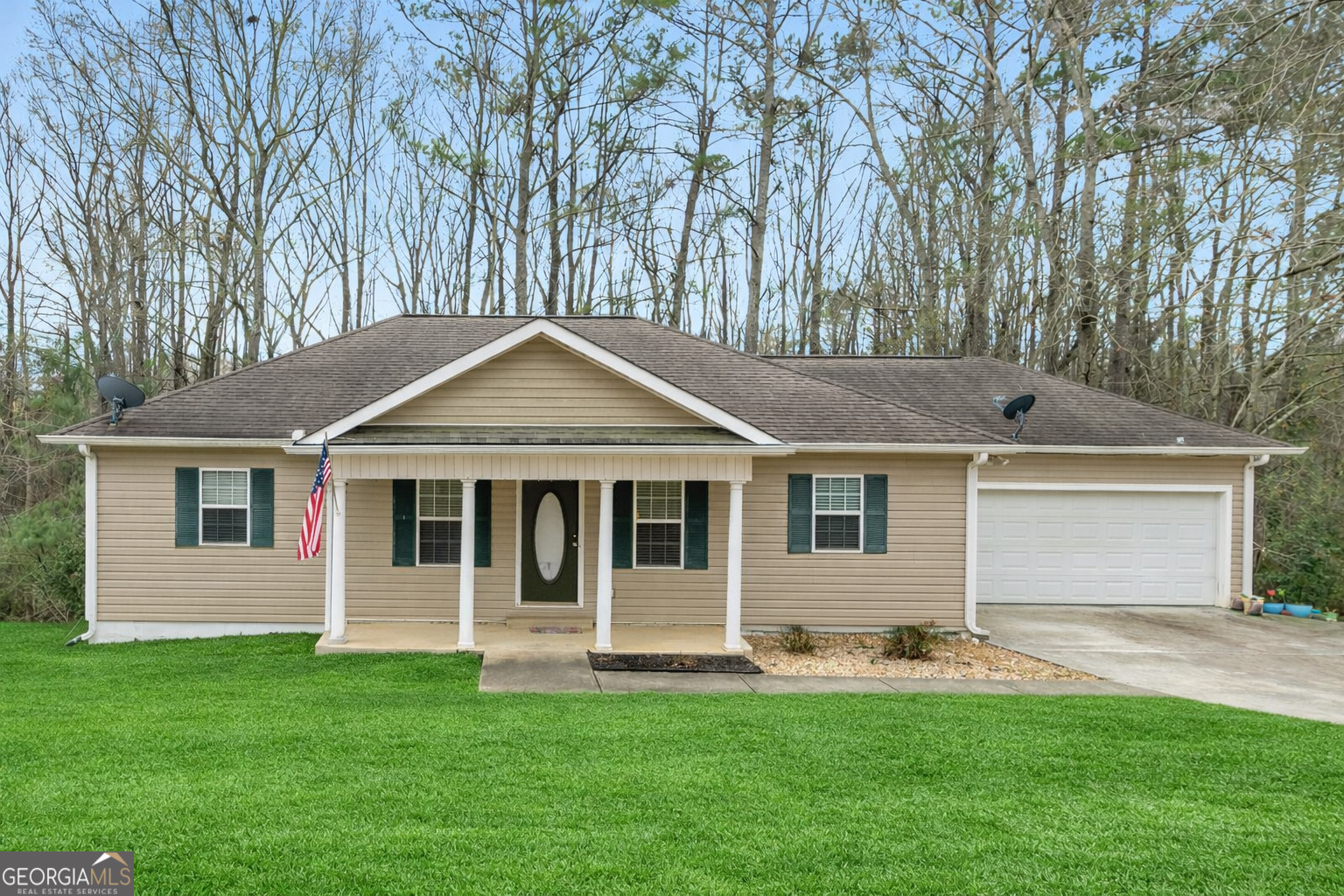 502 Fescue Street Thomaston, GA 30286 - Photo 1 of 1 a front view of a house with a yard and garage