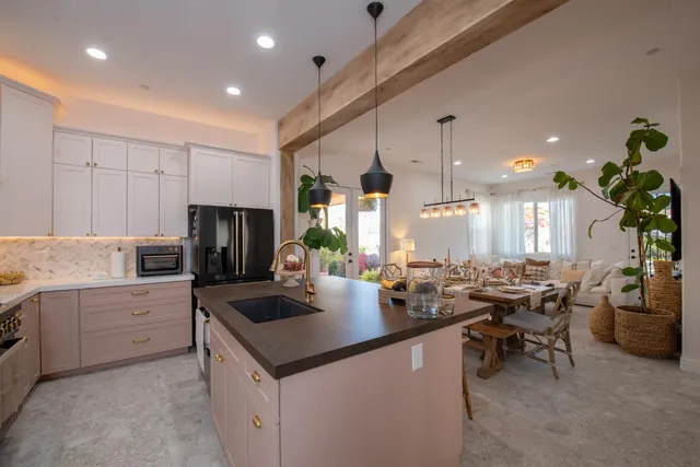 a view of an outdoor dining space with a table and chairs