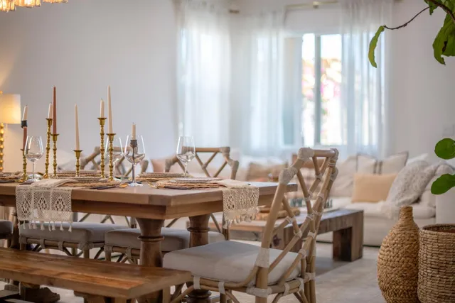 a living room with furniture a rug and a chandelier