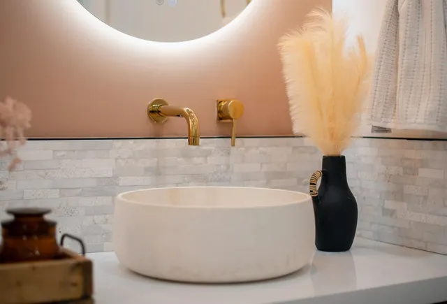 walk in closet with window and chandelier