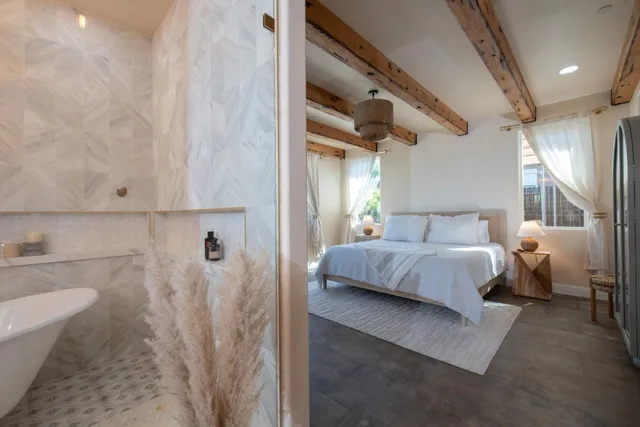 a bedroom with furniture and a flat screen tv