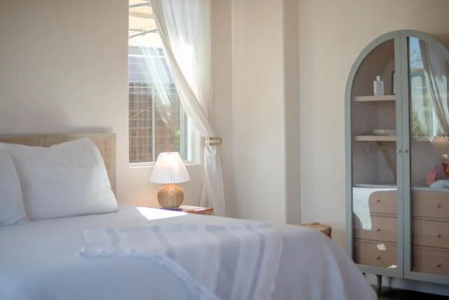 a spacious bathroom with a double vanity sink mirror and bathtub