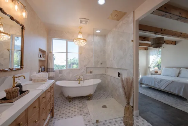 a bathroom with a sink a vanity and a mirror