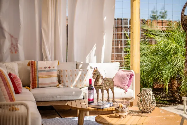 a outdoor dining space with furniture and outdoor seating