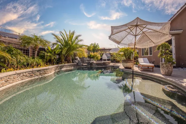 a view of swimming pool with outdoor seating