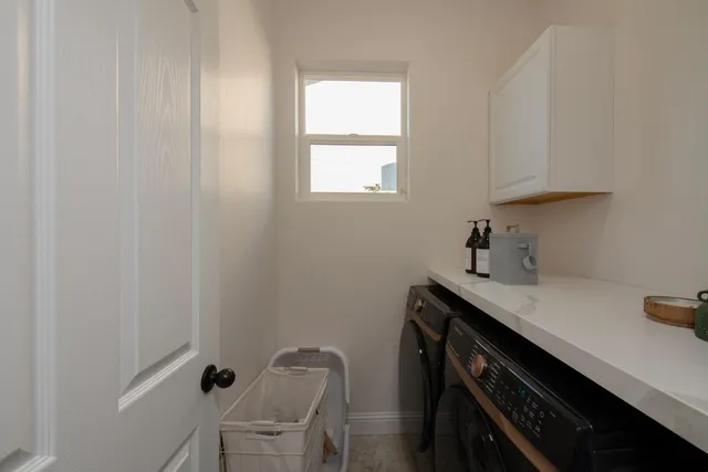 a kitchen that has a sink and a stove
