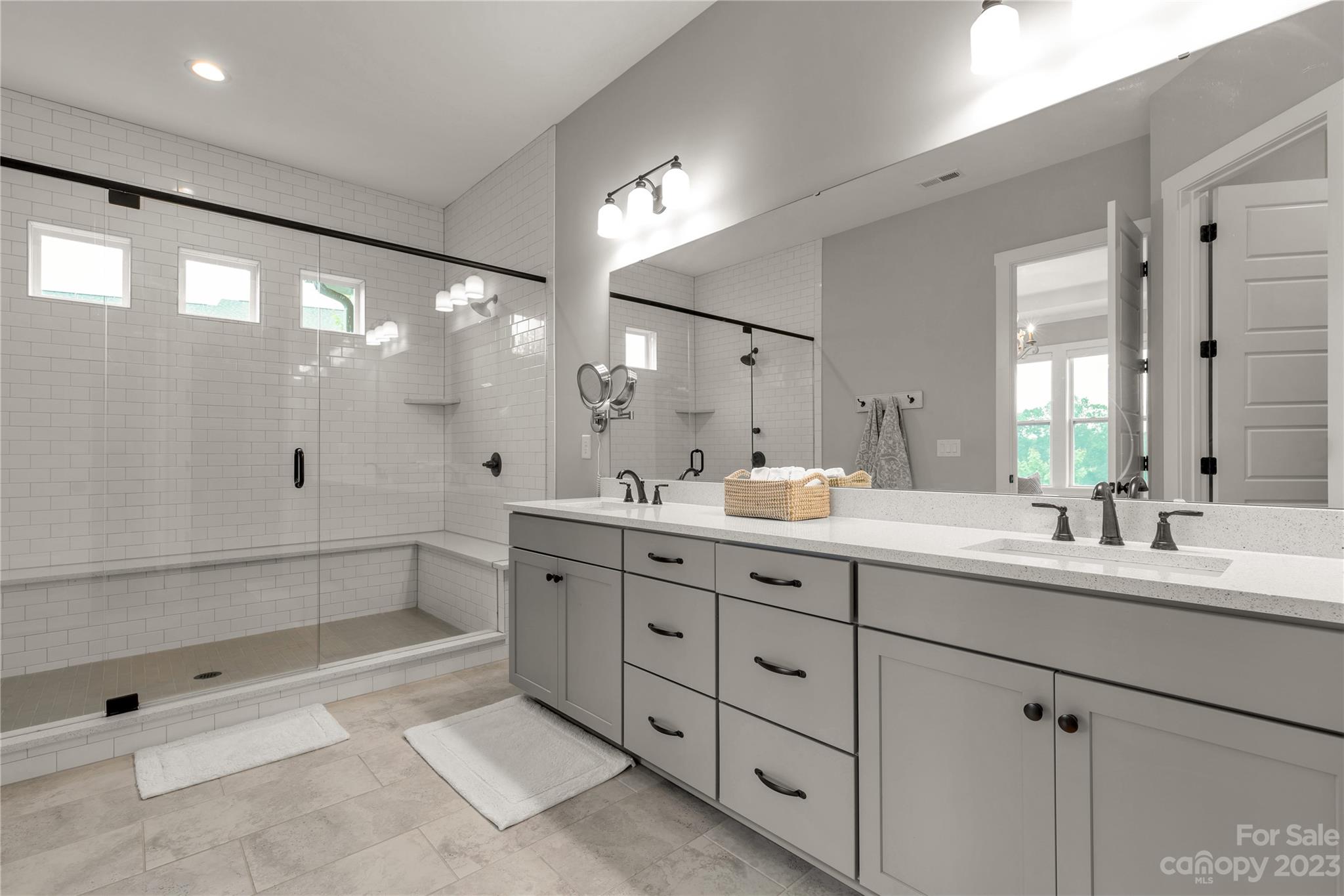 844 Bee Balm Trail Fort Mill, SC 29708 - Photo 20 of 48 a bathroom with double sink and a mirror