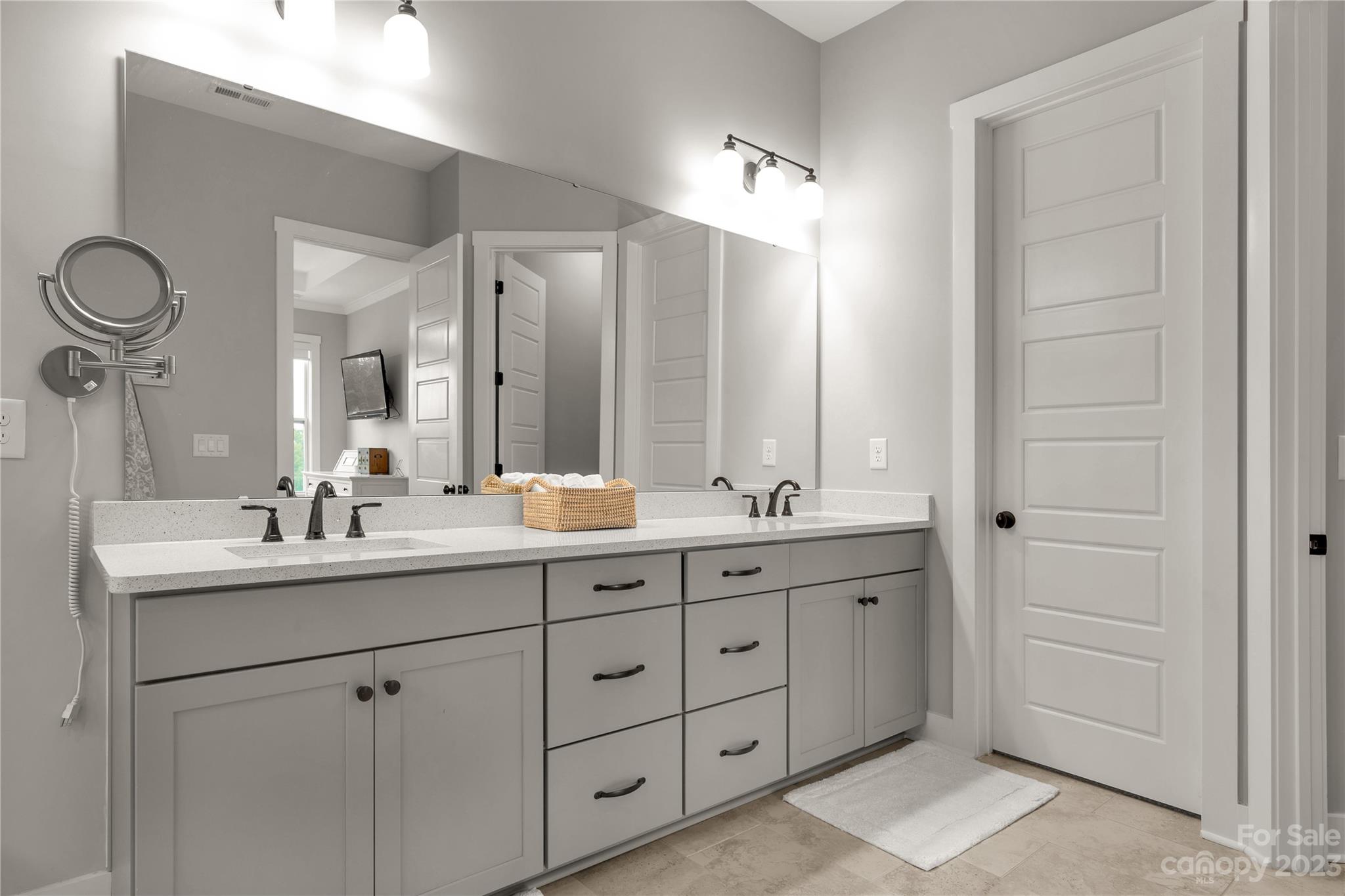 844 Bee Balm Trail Fort Mill, SC 29708 - Photo 21 of 48 a bathroom with a double vanity sink and a mirror