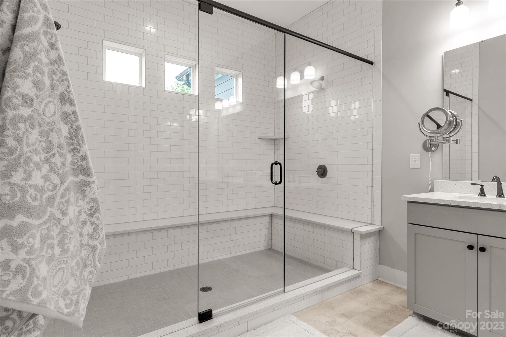 844 Bee Balm Trail Fort Mill, SC 29708 - Photo 22 of 48 a bathroom with a shower a mirror and a sink