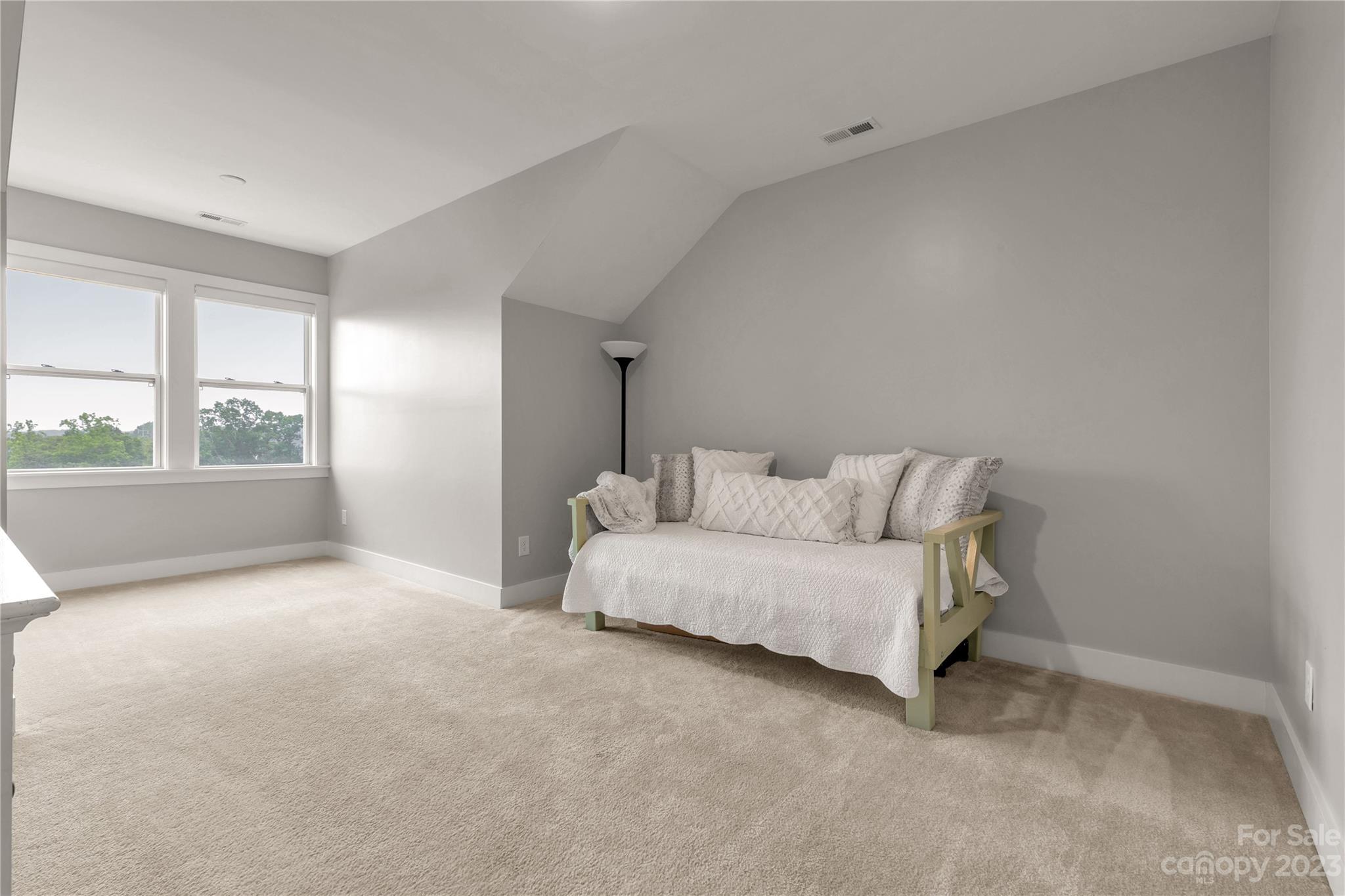 844 Bee Balm Trail Fort Mill, SC 29708 - Photo 26 of 48 a spacious bedroom with a bed and a large window