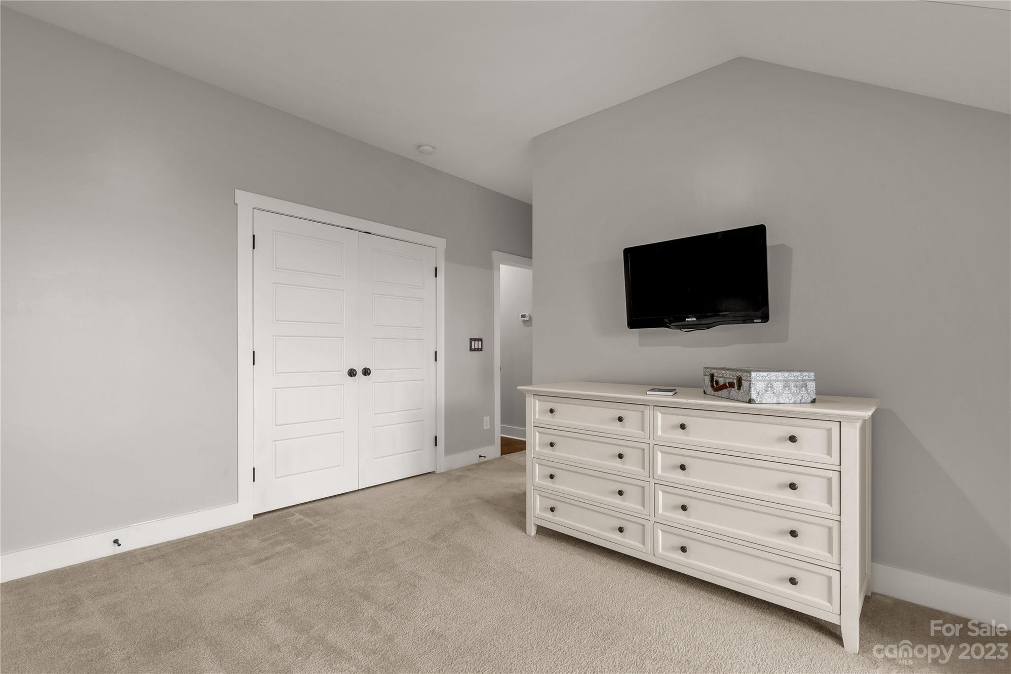 844 Bee Balm Trail Fort Mill, SC 29708 - Photo 27 of 48 a room with a television and a dresser